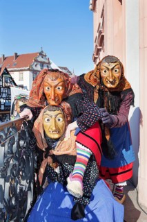 Three witches on the balcony of Gengenbach Town Hall