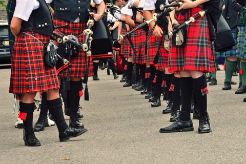 Members of a pipe band wearing kilts