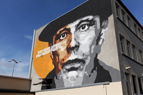 Portrait of the artist Joseph Beuys on a house wall