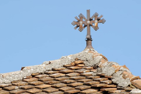 The cross on the tiled roof