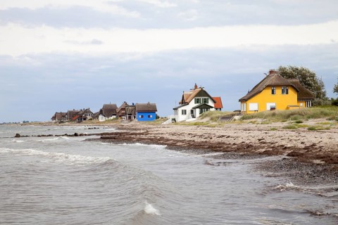 Cottages with thatched roofs on the coast