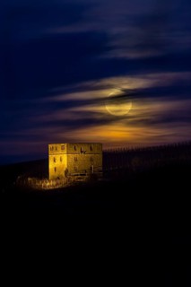 Ruins of Burg Y-burg Castle with a full moon