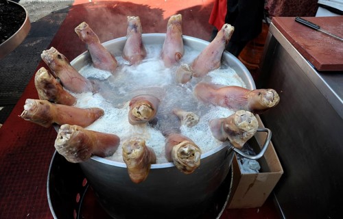 Pigs' feet boiling in a large pot at the annual All Saints Market in Cocentaina
