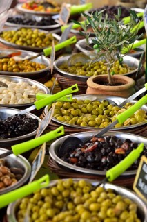 Various types of olives at a market stall
