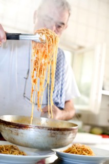Chef dishing up spaghetti