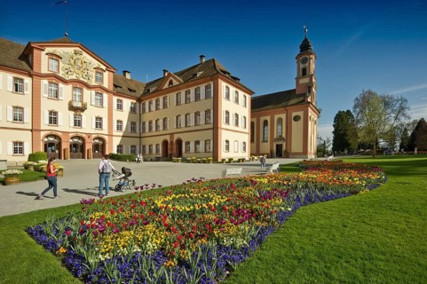 Schloss Mainau Castle with a colourful flower bed