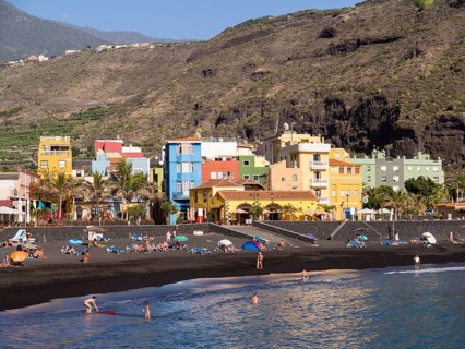 Tourists on the black beach of Puerto de Tazacorte