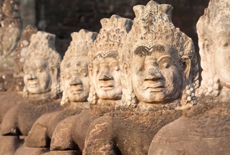 Asura statues aligned at the south gate causeway of Angkor Thom