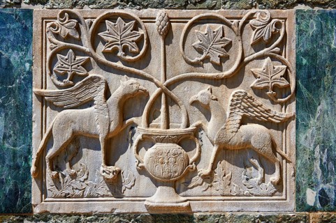 Medieval Oriental Byzantine bas-relief of two winged griffins on the facade of St Mark's Basilica