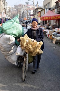 Man transporting goods with a bicycle