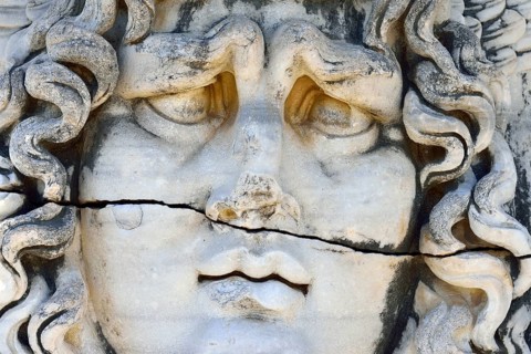 Antique Medusa or Gorgon head at the Apollon temple