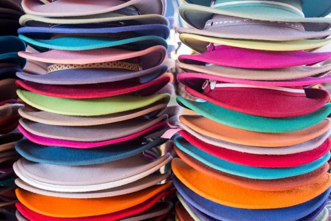 Stacks of colourful felt hats