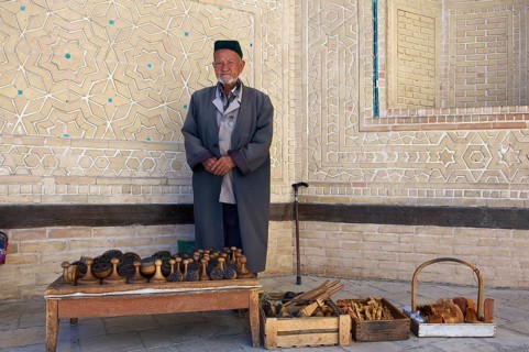 Local man with bread stamps in front of the Kalon Mosque