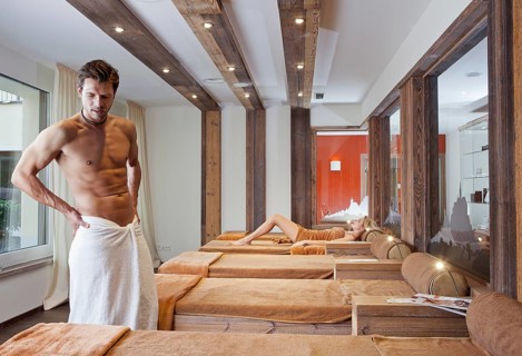 Man and woman relaxing in the relaxation area of a sauna