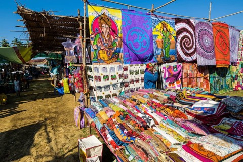 Colourful fabrics for sale at the weekly flea market