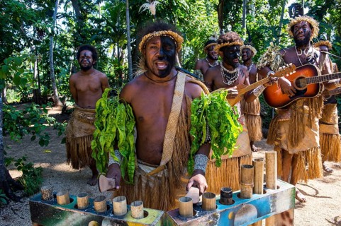 Group of traditional dressed men playing music