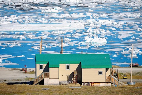 House of the Inuit people in the village of Ulukhaktok with ice floes in the Beaufort Sea