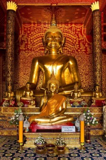 Golden Buddha statues in the Viharn of Wat Doi Ngam Muang