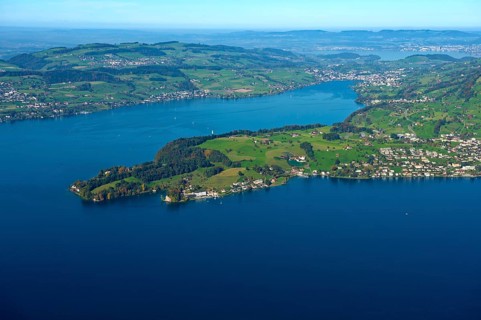 View from Mt Burgenstock of the Hertenstein peninsula in Lake Lucerne with the town of Weggis