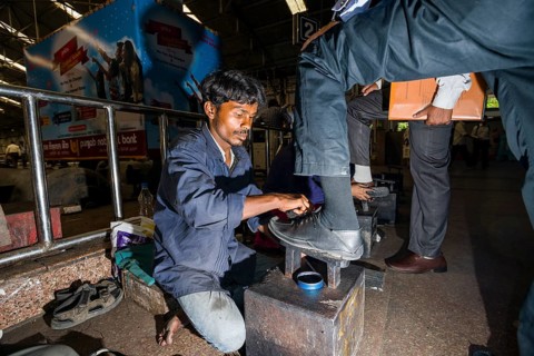 Shoeshine working inside Churchgate Railway Station