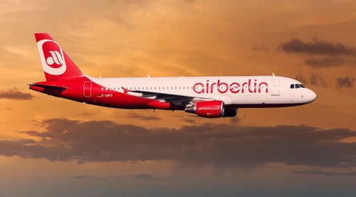 Air Berlin Airbus A320-214 in flight at night