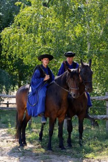 Two Csikos on horseback