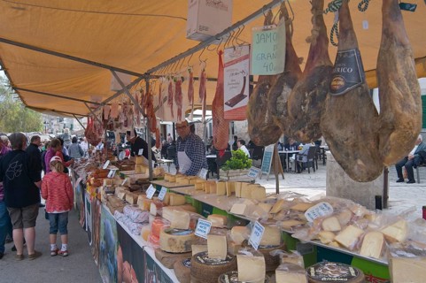 Market stall selling sausages and cheeses