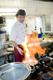 Flambe cooking in a kitchen