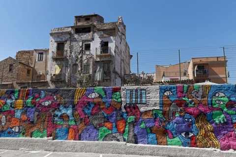 Colorful mural and dilapidated houses in the historic quarter of Borg Vecchio