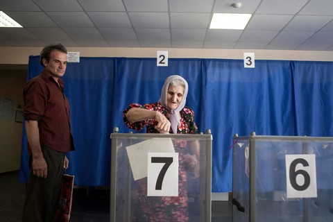 Elderly woman at the ballot box
