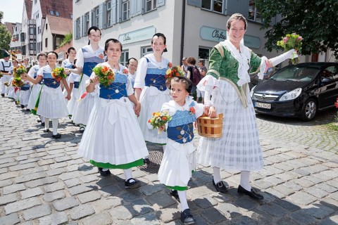 Women and children during a parade through the historic town centre