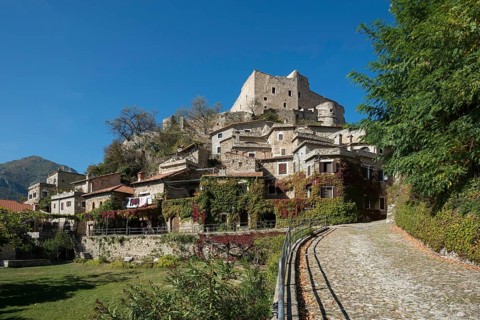 Medieval village with a castle in the mountains