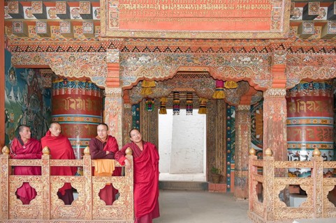 Four monks in red robes