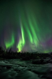 Northern lights or aurora borealis over river