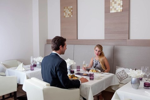 Man and woman having dinner in a restaurant