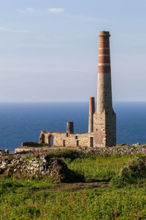 Ruins and chimney of the crushing plant of the former tin and copper mine Levant Mine