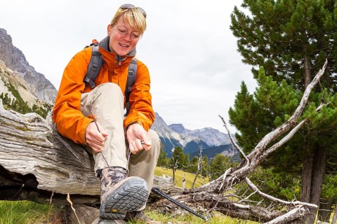 Woman lacing her hiking boots