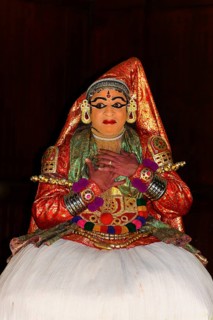 Fully made-up and costumed Kathakali dancer during a performance