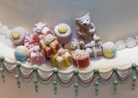 Christmas gifts and a teddy bear made of marzipan