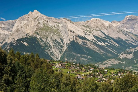 View from Haute-Nendaz over the Rhone Valley towards the summit of Haut de Cry Mountain in the Bernese Alps