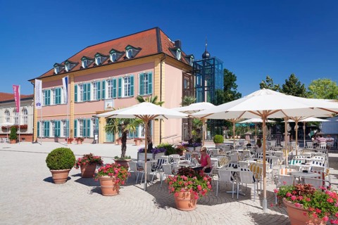 Sidewalk cafe and Palais Hirsch palace