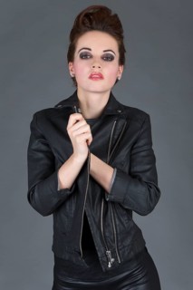 Young woman wearing a leather outfit