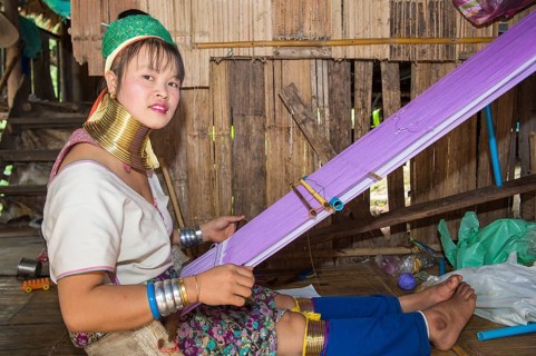 Long-necked woman weaving