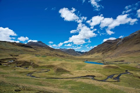Mountain valley with river and small lake