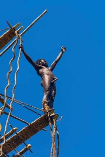 Man jumping from a bamboo tower