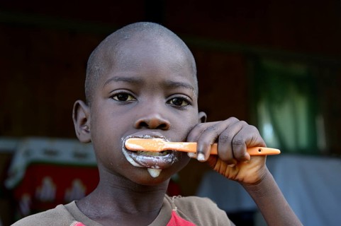 Young boy brushing his teeth