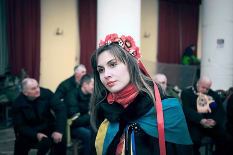 Volunteer distributing clothing in the occupied City Hall
