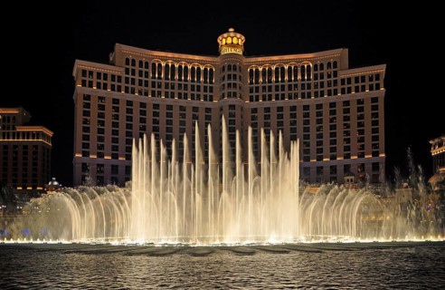 Bellagio Hotel and Casino with dancing water fountain show at night