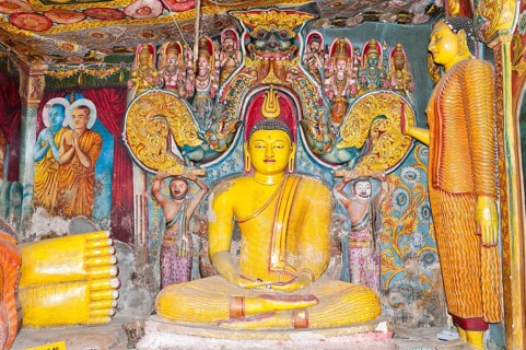 Brightly painted and richly decorated Buddha figure