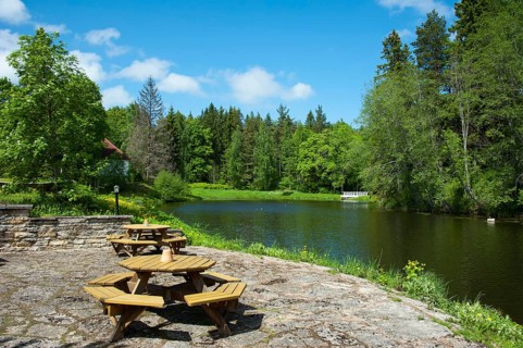 Tables and benches by the lake